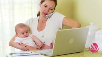 stock-footage-mother-working-on-laptop-with-baby