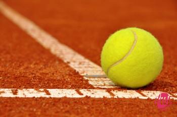 Tennis ball on a tennis clay court